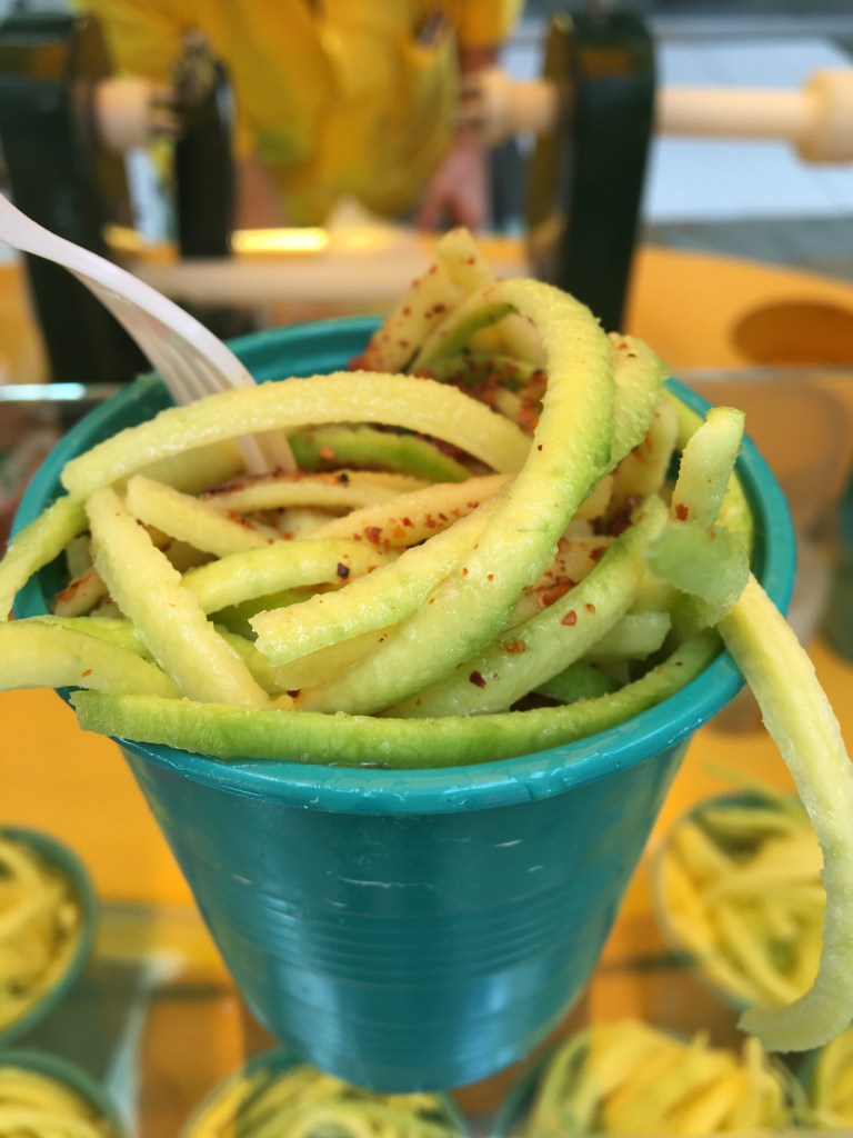Mango biche—green mango, sliced thin, with lime and salt.
